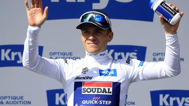 epa11477866 Belgian rider Remco Evenepoel of Soudal Quick-Step celebrates on the podium wearing the best young rider's white jersey following the end of the 15th stage of the 2024 Tour de France cycling race over 197km from Loudenvielle to Plateau de Beille, France, 14 July 2024.  EPA/GUILLAUME HORCAJUELO