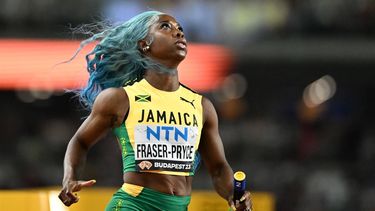 Jamaica's Shelly-Ann Fraser-Pryce looks on after crossing the finish line during the women's 4x100m relay heats during the World Athletics Championships at the National Athletics Centre in Budapest on August 25, 2023. 
Jewel SAMAD / AFP