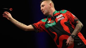 England's Nathan Aspinall competes during his quarter-final darts match against Wales' Gerwyn Price on Night 1 of the PDC Premier League, at the Utilita Arena in Cardiff, south Wales on February 1, 2024. 
Adrian DENNIS / AFP