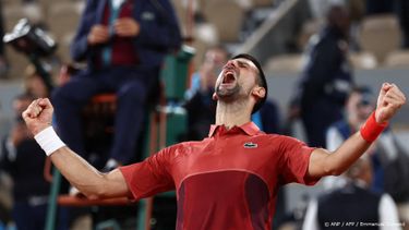 Serbia's Novak Djokovic celebrates after winning against Italy's Lorenzo Musetti at the end of their men's singles match on Court Philippe-Chatrier on day seven of the French Open tennis tournament at the Roland Garros Complex in Paris on June 2, 2024. 
EMMANUEL DUNAND / AFP