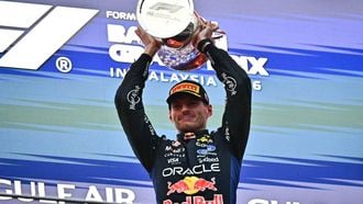 Race winner Red Bull Racing's Dutch driver Max Verstappen lifts his trophy during podium ceremony of the Formula One Bahrain Grand Prix in Sepang on October 4, 2026. 
Lillian SUWANRUMPHA / AFP