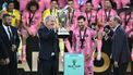 Inter Miami's managing owner Jorge Mas (C-L) lifts the trophy next to Argentine forward Lionel Messi (C-R) after winning the Major League Soccer (MLS) Cup final between Inter Miami and the Vancouver Whitecaps at Chase Stadium in Fort Lauderdale, Florida, on December 6, 2025. 
CHANDAN KHANNA / AFP