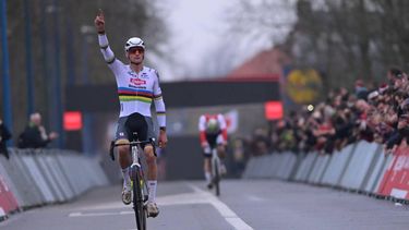 Dutch Mathieu Van Der Poel celebrates as he crosses the finish line to win the men's elite race of the 6th stage of the world cup cyclocross, in Koksijde on December 21, 2025. 
DAVID PINTENS / Belga / AFP