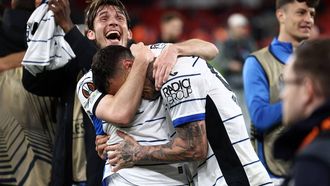 Atalanta's Dutch midfielder #15 Marten de Roon (L) celebrates with Atalanta's Italian forward #90 Gianluca Scamacca after the UEFA Europa League quarter-final first leg football match between Liverpool and Atalanta at Anfield in Liverpool, north west England on April 11, 2024. Atalanta won the match 3-0.
Darren Staples / AFP