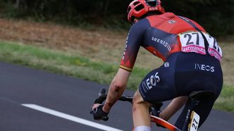2023-07-22 14:44:04 INEOS - Grenadiers' Spanish rider Carlos Rodriguez Cano cycles to catch up to the pack of riders after crashing during the 20th stage of the 110th edition of the Tour de France cycling race 133 km between Belfort and Le Markstein Fellering, in Eastern France, on July 22, 2023. 
Thomas SAMSON / AFP