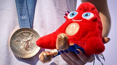 Romanian gymnast Ana Maria Barbosu poses with the mascot of the Paris 2024 Olympic Games and with her Olympic bronze medal she was given on August 16, 2024 in Bucharest, Romania, after a gymnast from the US was stripped of it. Barbosu was awarded the Olympic floor exercise bronze medal originally given to Jordan Chiles, following a decision by the International Olympic Committee (IOC). The IOC decision followed a Court of Arbitration for Sport (CAS) ruling which cancelled the re-evaluation of Chiles' score on the grounds that the appeal of her degree of difficulty was lodged by the US team four seconds after the regulatory deadline, set at one minute.
Daniel MIHAILESCU / AFP