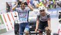 epa12071235 Lenny Martinez (L) from France of team Bahrain Victorius celebrates winning, past Joao Almeida from Portugal of UAE Team Emirates XRG, the fourth stage, a 118,2 km race between Sion and Thyon 2000 at the 78th Tour de Romandie UCI World Tour Cycling race, in Thyon, Switzerland, 03 May 2025.  EPA/JEAN-CHRISTOPHE BOTT