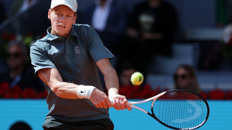 Italy's Jannik Sinner returns a ball to France's Arthur Fils during their 2026 ATP Tour Madrid Open tennis tournament semi-final singles match at the Caja Magica in Madrid, on May 1, 2026. 
Thomas COEX / AFP