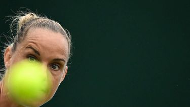 Netherlands' Arantxa Rus eyes the ball as she returns it to Greece's Maria Sakkari during their women's singles second round tennis match on the third day of the 2024 Wimbledon Championships at The All England Lawn Tennis and Croquet Club in Wimbledon, southwest London, on July 3, 2024. 
Ben Stansall / AFP