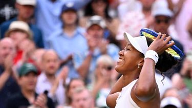 Japan's Naomi Osaka celebrates beating Belarus's Aryna Sabalenka during their women's singles round of 16 tennis match on the seventh day of the 2026 Wimbledon Championships at The All England Lawn Tennis and Croquet Club in Wimbledon, southwest London, on July 5, 2026. 
Kirill KUDRYAVTSEV / AFP