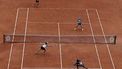 epa09996975 Coco Gauff and Jessica Pegula (front R-L) of the USA play Caroline Garcia and Kristina Mladenovic of France (back R-L) in their Womens’ Doubles final match during the French Open tennis tournament at Roland ​Garros in Paris, France, 05 June 2022.  EPA/CHRISTOPHE PETIT TESSON