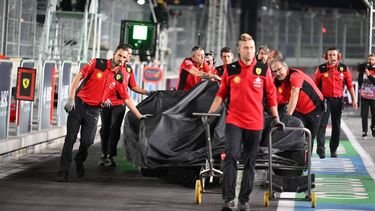 The car of Ferrari's Spanish driver Carlos Sainz Jr., is returned to the pit after an accident during the first practice session for the Las Vegas Formula One Grand Prix on November 16, 2023, in Las Vegas, Nevada.  Race stewards cancelled the practice after the accident to inspect the track.
ANGELA WEISS / AFP