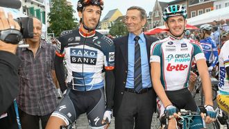 (FILES) (From L) Swiss Fabian Cancellara of team Saxo Bank, former cyclist Rik Van Looy and Belgian Jurgen Van Den Broeck of team Omega Pharma-Lotto are pictured before the after-Tour criterium in Herentals, on July 29, 2010, as part of the classic races for cyclists who took part in the 2010 Tour de France.  Belgian rider Rik Van Looy, considered one of the greatest riders in history and winner of every cycling landmark, died at the age of 90, several Belgian media reported on December 18, 2024.
PETER DECONINCK / BELGA / AFP