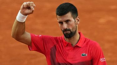 Serbia's Novak Djokovic celebrates his victory over France's Corentin Moutet during their men's singles match on day 5 of the French Open tennis tournament on Court Suzanne-Lenglen at the Roland-Garros Complex in Paris on May 29, 2025. 
Dimitar DILKOFF / AFP