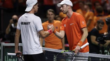 Botic Van de Zandschulp of Team Netherlands (R) shakes hands with Daniel Altmaier of Team Germany after winning their semi-final singles match between Germany and Netherlands at the Davis Cup Finals at the Palacio de Deportes Jose Maria Martin Carpena arena in Malaga, southern Spain, on November 22, 2024. 
Thomas COEX / AFP