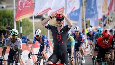 Tudor Pro Cycling Team's Netherland rider Rick Pluimers celebrates as he crosses the finish line to win the one day Muscat Classic cycling race ahead of second place Arkea B&B Hotels Team's Belgian rider Jenthe Biermans (R), and third place XDS Astana team's Erythrean rider Henok Mulueberhan (L), in Muscat on February 7, 2025. 
Loic VENANCE / AFP