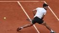 Spain's Carlos Alcaraz plays a backhand return to Italy's Giulio Zeppieri during their men's singles match on day 2 of the French Open tennis tournament on Court Suzanne-Lenglen at the Roland-Garros Complex in Paris on May 26, 2025. 
Franck FIFE / AFP
