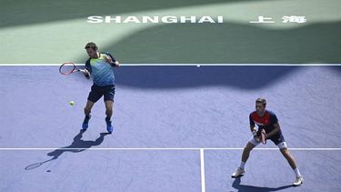 2023-10-11 22:02:44 Netherlands' Wesley Koolhof (R) and Britain’s Neal Skupski play a point against France’s Sadio Doumbia and Fabien Reboul during their men's doubles quarter-final match at the Shanghai Masters tennis tournament on October 12, 2023. 
WANG Zhao / AFP