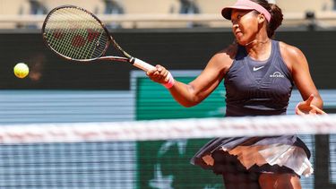 Japan's Naomi Osaka plays a forehand return to Italy's Lucia Bronzetti during their women's singles match on day one of The French Open tennis tournament on Court Philippe-Chatrier at The Roland Garros Complex in Paris on May 26, 2024. 
Alain JOCARD / AFP
