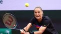 Netherlands' Arantxa Rus plays a backhand return to Kazakhstan's Elena Rybakina during their women's singles match on Court Suzanne-Lenglen on day five of the French Open tennis tournament at the Roland Garros Complex in Paris on May 30, 2024. 
EMMANUEL DUNAND / AFP