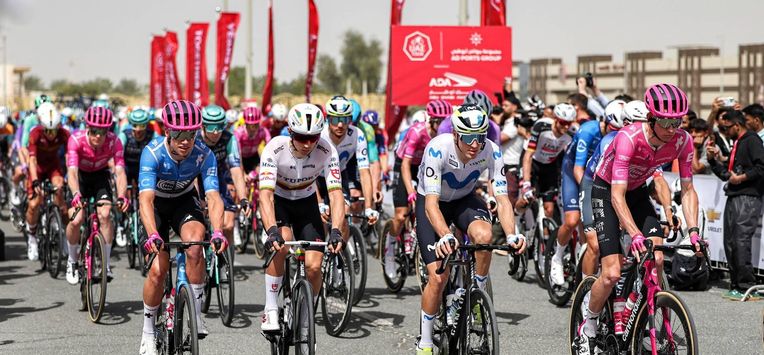 Riders launch from the start line during the first stage of the UAE Tour cycling event from Madinat Zayed Majlis to Liwa Palace in Abu Dhabi on February 16, 2026. 
Fadel SENNA / AFP