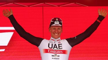 2023-05-17 18:15:27 UAE Team Emirates's German rider Pascal Ackermann celebrates on the podium after winning the eleventh stage of the Giro d'Italia 2023 cycling race, 219 km between Camaiore and Tortona, on May 17, 2023. 
Luca Bettini / AFP