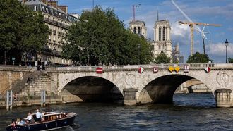 A motorboat goes up the Seine passing next to Notre Dame cathedral in Paris on June 3, 2024. 
JOEL SAGET / AFP