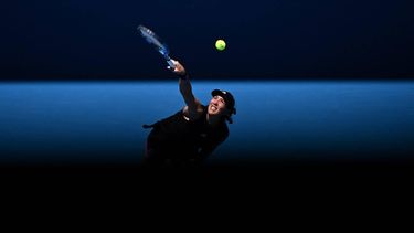 epa10409873 Garbine Muguruza of Spain in action against Elise Mertens of Belgium during their first round singles match at the 2023 Australian Open tennis tournament at Melbourne Park in Melbourne, Australia, 17 January 2023.  EPA/JOEL CARRETT  AUSTRALIA AND NEW ZEALAND OUT