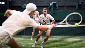 Britain's Joe Salisbury (R) returns the ball to Netherlands' Sem Verbeek and Czech Republic's Katerina Siniakova during their mixed's doubles final tennis match on the eleventh day of the 2025 Wimbledon Championships at The All England Lawn Tennis and Croquet Club in Wimbledon, southwest London, on July 10, 2025. 
Kirill KUDRYAVTSEV / AFP