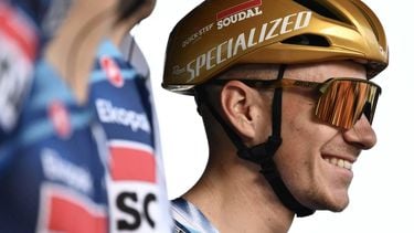 Soudal Quick-Step’s Belgian rider Remco Evenepoel looks on from the sign-in podium ahead of the 119th edition of the Giro di Lombardia (Tour of Lombardy), a 238km cycling race from Como to Bergamo on October 11, 2025. 
Marco BERTORELLO / AFP
