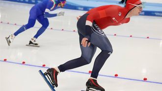 epa10982337 Davide Ghiotto of Italy (L) and Sander Eitrem of Norway in action during the men's 5000 m Division A race at the ISU Speed Skating World Cup in Beijing, China, 18 November, 2023.  EPA/ANDRES MARTINEZ CASARES