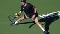 epa11950477 Botic Van de Zandschulp of the Netherlands in action against Novak Djokovic of Serbia during their men's second round match at the BNP Paribas Open tennis tournament in Indian Wells, California, USA, 08 March 2025.  EPA/JOHN G. MABANGLO