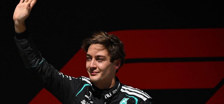 Mercedes' British driver George Russell celebrates winning the sprint race ahead of the Formula One Chinese Grand Prix at the Shanghai International Circuit in Shanghai on March 14, 2026. 
JADE GAO / AFP
