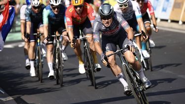 Alpecin-Deceuninck team's Belgian rider Jasper Philipsen (C) cycles past the finish line to win ahead of second-placed Bahrain - Victorious team's German rider Phil Bauhaus (R) and third-placed Uno-X Mobility team's Norwegian rider Alexander Kristoff (3rd L) during the 16th stage of the 111th edition of the Tour de France cycling race, 188,6 km between Gruissan and Nimes, southern France, on July 16, 2024. 
Anne-Christine POUJOULAT / AFP