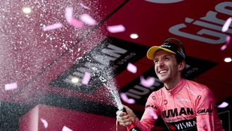 Team Visma-Lease a Bike's British rider Simon Yates celebrates on the podium after winning the pink jersey of overall leader (Maglia Rosa) in the 20th stage of the 108th Giro d'Italia cycling race 205kms from Verres to Sestriere on May 31, 2025. 
Luca Bettini / AFP