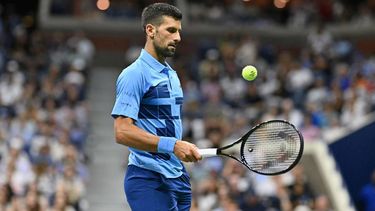 Serbia's Novak Djokovic controls the ball as he plays against Australia's Alexei Popyrin during their men's singles third round match on day five of the US Open tennis tournament at the USTA Billie Jean King National Tennis Center in New York City, on August 30, 2024. 
ANGELA WEISS / AFP