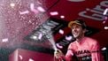 Team Visma-Lease a Bike's British rider Simon Yates celebrates on the podium after winning the pink jersey of overall leader (Maglia Rosa) in the 20th stage of the 108th Giro d'Italia cycling race 205kms from Verres to Sestriere on May 31, 2025. 
Luca Bettini / AFP