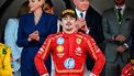 Race winner Ferrari's Monegasque driver Charles Leclerc (C) stands on the podium as Prince Albert II of Monaco (R) and Princess Charlene (L) applaud after the Formula One Monaco Grand Prix on May 26, 2024 at the Circuit de Monaco. 
NICOLAS TUCAT / AFP