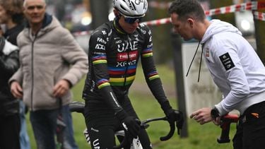 A mechanic checks the bike of Team UAE's Slovenian rider Tadej Pogacar, before the start of the Milan - Sanremo one-day classic cycling race, in Pavia, near Milan, on March 22, 2025. 
Marco BERTORELLO / AFP
