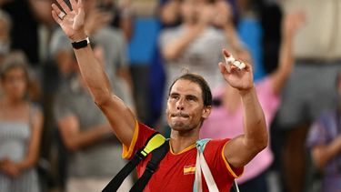 Spain's Rafael Nadal waves goodbye after he and Spain's Carlos Alcaraz  lose to US' Austin Krajicek and US' Rajeev Ram in their men's doubles quarter-final tennis match on Court Philippe-Chatrier at the Roland-Garros Stadium during the Paris 2024 Olympic Games, in Paris on July 31, 2024.  
CARL DE SOUZA / AFP