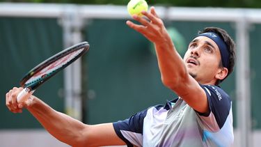 epa11376964 Lorenzo Sonego of Italy serves during his Men's Singles 2nd round match against Zhizhen Zhang of China at the French Open Grand Slam tennis tournament at Roland Garros in Paris, France, 29 May 2024.  EPA/CHRISTOPHE PETIT TESSON