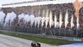 Pyrotechnics go off as Red Bull Racing's Dutch driver Max Verstappen crosses the finish line to win the Dutch Formula One Grand Prix race at The Circuit Zandvoort, in Zandvoort on August 27, 2023. 
John THYS / AFP