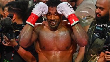British boxer Anthony Joshua celebrates after defeating US boxer and influencer Jake Paul (off frame) in a non-title heavyweight bout at the Kaseya Center in Miami, Florida, on December 19, 2025. 
Giorgio VIERA / AFP