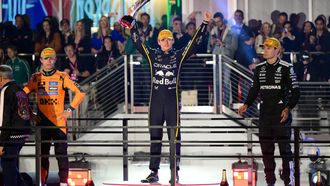 Race winner Red Bull Racing's Dutch driver Max Verstappen (C) celebrates with second place finisher McLaren's British driver Lando Norris (L) and third place finisher Mercedes' British driver George Russell (R) on the podium after the Las Vegas Formula One Grand Prix at the Las Vegas Strip Circuit in Las Vegas, Nevada, on November 22, 2025. Formula One world champion Max Verstappen produced a masterful drive to win the Las Vegas Grand Prix on Saturday as McLaren's Lando Norris finished second to edge closer to a maiden drivers' title.
Red Bull ace Verstappen pounced on a slip by pole-sitter Norris on the first turn of Sin City's street circuit to grab the lead and controlled the race thereafter to claim the 69th Grand Prix win of his career, finishing more than 20 seconds clear.

Frederic J. Brown / AFP