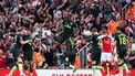 Brentford's Italian defender #33 Michael Kayode (C) celebrates his team first goal scored by Brentford's French-born DR Congo striker #11 Yoane Wissa during the English Premier League football match between Arsenal and Brentford at the Emirates Stadium in London on April 12, 2025.  
Adrian Dennis / AFP