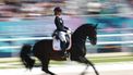 Netherlands' Dinja Van Liere with horse Hermes competes in the equestrian's dressage individual grand prix day 1 during the Paris 2024 Olympic Games at the Chateau de Versailles in Versailles, in the western outskirts of Paris, on July 30, 2024. 
Pierre-Philippe MARCOU / AFP