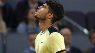 epa11312797 Carlos Alcaraz of Spain looks disappointed after losing against Andrey Rublev of Russia in their quarter final match at the Madrid Open tennis tournament in Madrid, central Spain, 01 May 2024.  EPA/Juanjo Martin