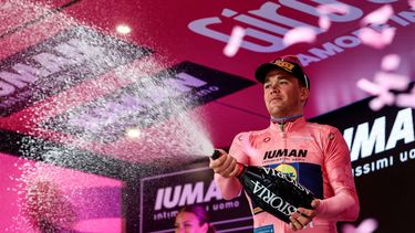 Stage winner Lidl-Trek's Danish rider Mads Pedersen wearing the overall leader's pink jersey (Maglia Rosa) sprays champagne as he celebrates on the podium after the 3rd stage of the 108th Giro d'Italia cycling race, 160km from Vlore to Vlore in Albania, on May 11, 2025. 
Luca Bettini / AFP