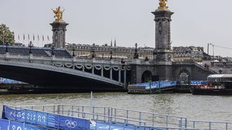 This photograph shows infrastructure on the venue of the swimming portion of the Paris 2024 Olympic Games triathlon, next to the Alexandre III bridge, on July 30, 2024. The Paris Olympics men's triathlon was postponed just hours before it was due to get under way on July 30 after water quality tests on the River Seine revealed it was still too dirty for swimming, organisers said.
Thibaud MORITZ / AFP