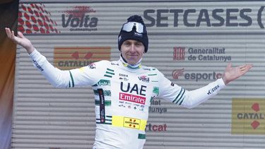 epa11229910 Tadej Pogacar of UAE Team Emirates celebrates on the podium after winning the second stage of the Volta Ciclista a Catalunya, a cycling race over 186.5 km from Mataro to Vallter, Spain, 19 March 2024.  EPA/Enric Fontcuberta